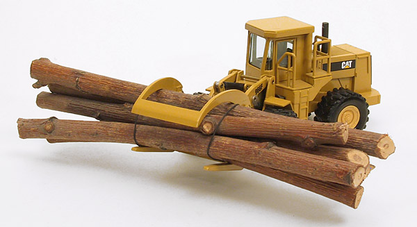 Foto Caterpillar 966F mit Holzgreifer